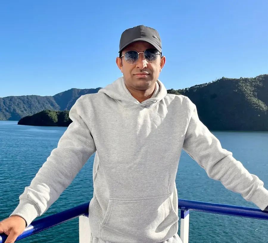 Dipak Rijal natural profile photo in New Zealand lake setting